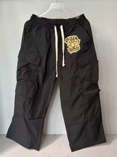 Mixed Emotion Patch Logo Multi‑Pocket Cargo Pants
